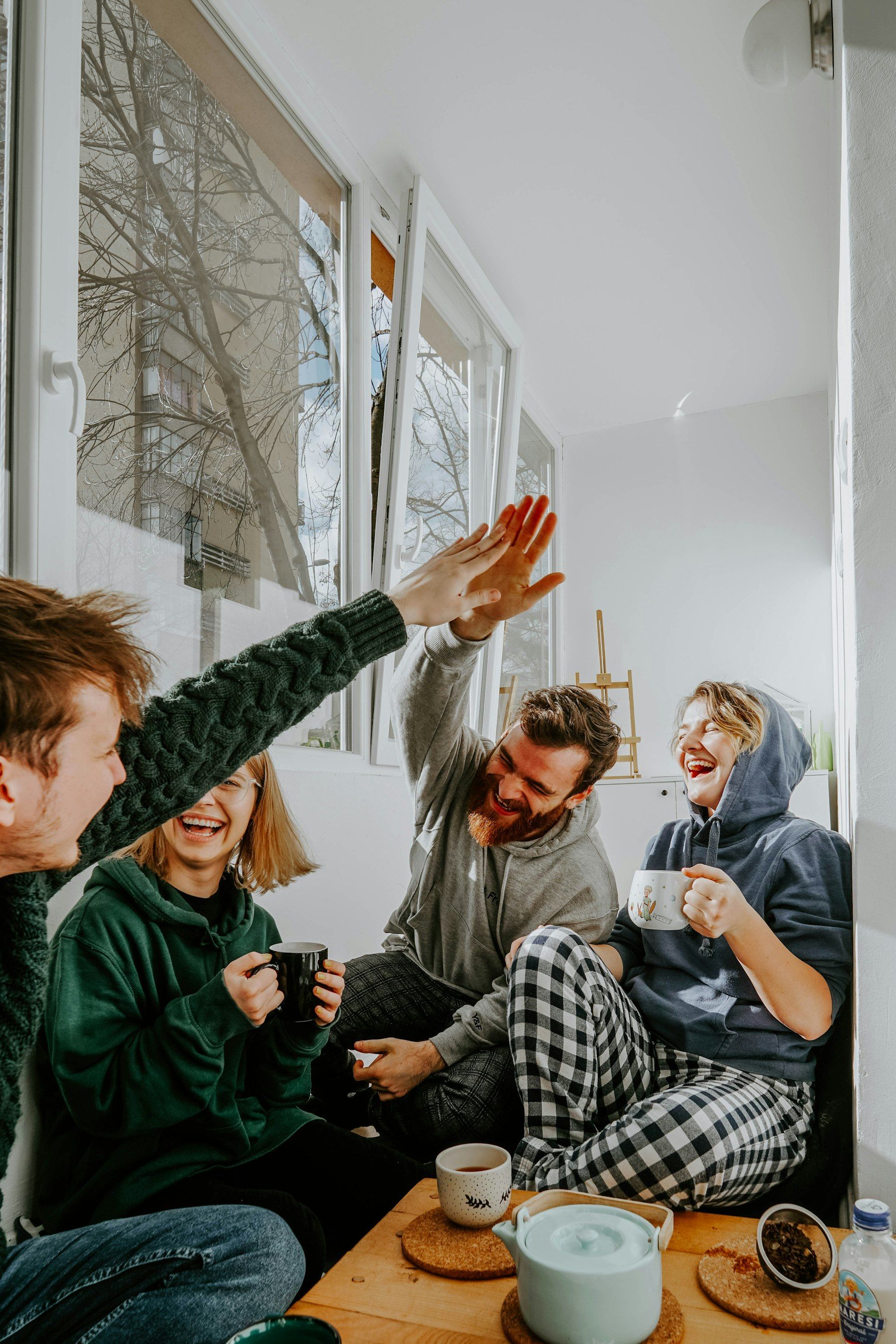 Friends laughing over coffee