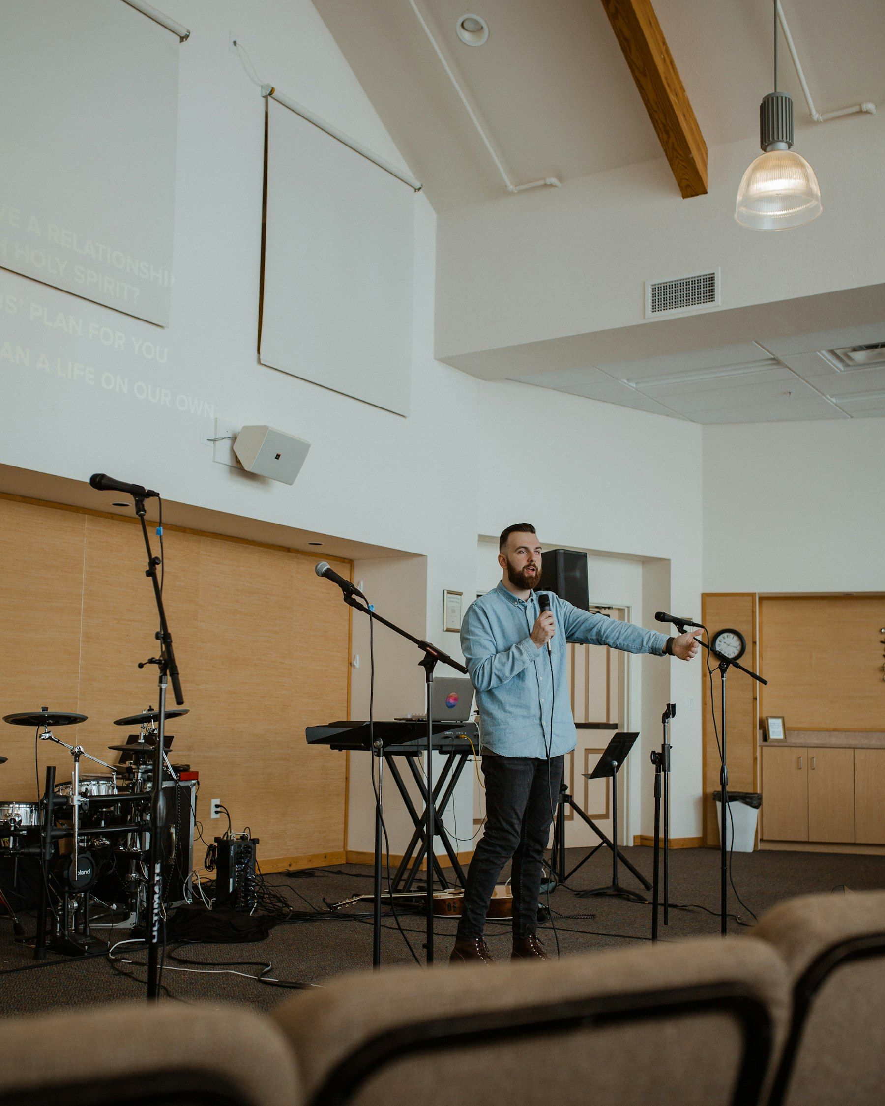 A pastor speaking on stage